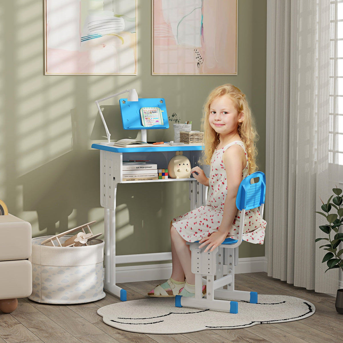 Kids adjustable desk and chair set with blue tabletop and chair in a home play area